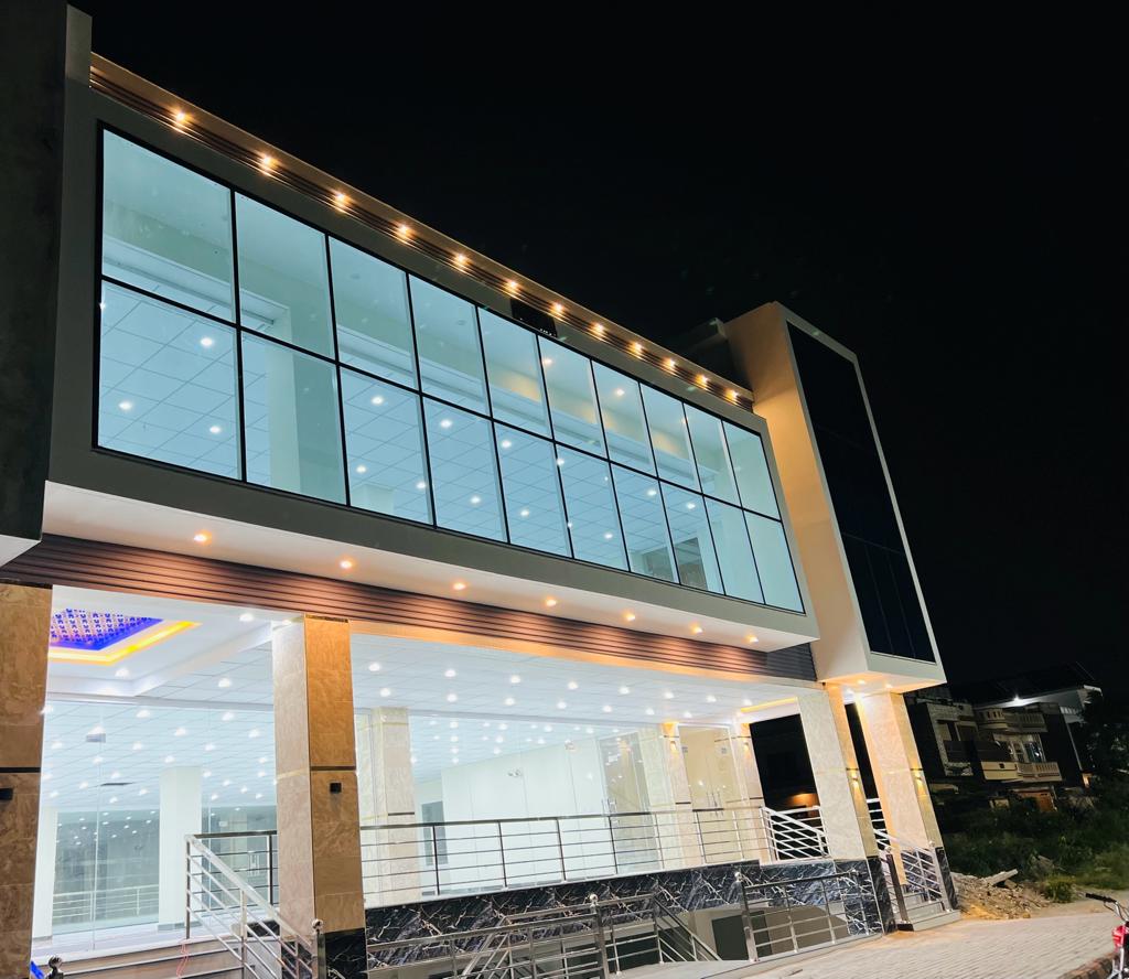 Karachi Office construction - Double glass entrance door with steel handle grip